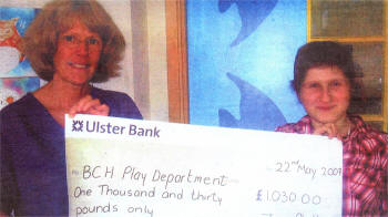Yvonne Reid, play specialist from Bristol Children's Hospital accepting a cheque from Zoe Philips.