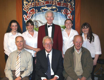Pictured at a centenary concert in Maghaberry Orange Hall last Friday evening (19th September) are L to R: (seated) Roy Wilson (Secretary), Alwyn Totten (Conductor) and Sandy Wilson (Chairman) of Roses Lane Ends Flute Band and (back row) Baillies Mills Accordion Band members Charlotte Nelson, Helen White, Brian Johnston (Secretary), Louise Shortt and Kirsty Shortt.