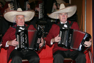 Baillies Mills Accordion Band members Sammy Pollock and Arthur Gibson don sombreros creating a carnival mood as the band plays the well known tune, ï¿½Spanish Eyesï¿½.
