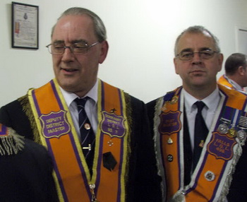 Falls LOL No 498 members Hugh Moulds (Treasurer) and his brother Ken Moulds (Past Master) pictured at the unfurling of a new banner in Derriaghy Orange Hall on Saturday 22nd November.
