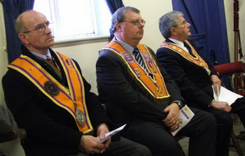 At the unfurling of a new banner in Derriaghy Orange Hall on Saturday 22nd November are visiting brethren L to R: Bro Tom Wright (County Grand Secretary - Belfast), Bro Connor Gray (Worshipful District Master of Derriaghy District LOL No 11) and The Most Worshipful Robert Saulters (Grand Master).