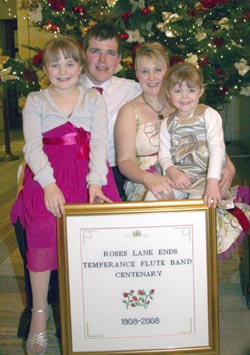 David and Gillian Steele and family pictured with Gillianï¿½s intricate cross-stitched picture.