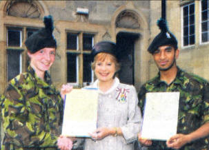 Receiving the BTEC Award and congratulations from Lady Carswell, Her Majesty's Lord Lieutenant for the City of Belfast, are (from left) Cadet Patrick Hunter and Cadet Chris Duly
