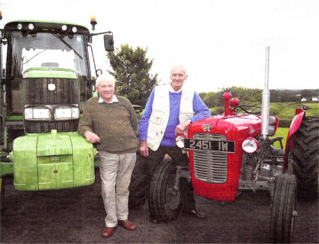 "Old and the New - Alan Ross and Michael Timmons with the tractors to be used in the road run, namely a John Deere 6920S and Massey Ferguson 35X US3508-403PM Pic by Paul Murphy