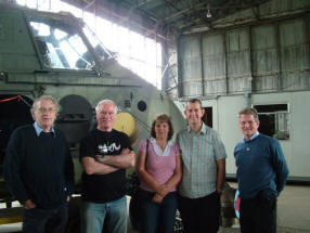 Edwin Poots MLA and Aviation Society members beside the Wessex helicopter.