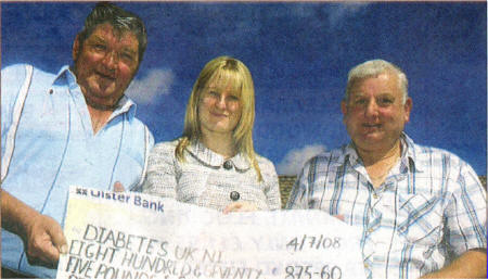 Geordie Wilkinson and Russell Beck presnting a cheque for ï¿½875 to Jennie McGivern, National FundRaising manager for Diabetes UK Northern Ireland.