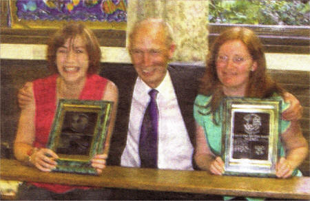 Mrs Carol Duffy and Mrs Sharon Curran receiving the Tom Conway Memorial Awards from Terry Conway