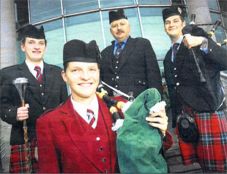 Pictured at the launch are (front) Mariad Wilson, Piper, Annsborough Pipe Band, (back l-r) Ryan Ferry, Drum Major and current European title holder from the Aughintober Pipe Band, Kenny Crowthers, Treasurer, RSPBA and Jonathon Greenlees, Piper and current world champion, Field Marshal Montgomery Band