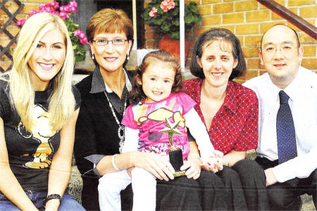 Valerie Doak with little Rebekah who she child minds for parents Martin and Anne Pollock. Also included is Valerie's daughter, Amanda Doak. US3809-552CD