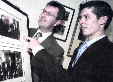 Ben Mallon who is going to the Republican Party Convention pictured with Jeffrey Donaldson as they look over pictures of Jeffrey Donaldson's visit to the Whitehouse in the Mid 90s with former American President Bill Clinton. US3308-117A0 Picture By: Aidan O'Reilly