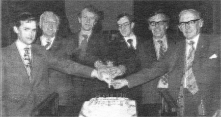 Celebrating its 21st birthday in 1979. From Left: Rev. John Keefe (Chaplain), late Cecil Alister (Lt), Robin Irvine (past Capt), Joe Watson (Capt), Ronnie Kenney (Lt) and late Hugh Stewart (President).