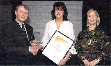 Lt Col Phil Thorpe and It Col Liz Brown presenting Allison Masters with her award