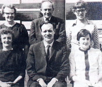 Former Principal of Ballymacrickett Primary School Mr Jim McCann, with caretaker Paddy Trowlen and members of the kitchen staff in the 1960's.