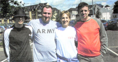 Scotty Robertson, Steen Wilson and Simon Wilson with Catherine Murnin from the Child Brain Injury Trust at the Mourne Walk Fundraiser. US3308-