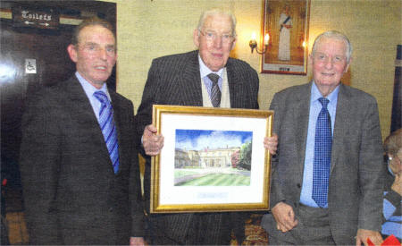 David Ferguson and Charlie Poots present Dr Ian Pasiley with a picture of Hillsborough.