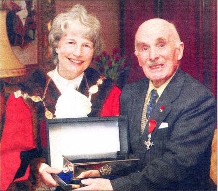 The then Mayor Cllr Betty Campbell presenting the first ever freeman of the city honour to Dr Semple in 2003.