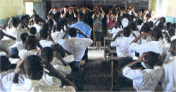 Friends' pupils teaching English in a local primary school with the help of 'Head, shoulders, knees and toes'