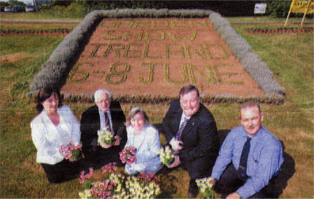 With Lisburn City Council's floral badge promoting the Garden Show Ireland 2008 are Event Organiser Karen Williams; Chairman of the Economic Development Committee ClIr Allan Ewart; Hillsborough District and Village Committee Secretary Nessa 0' Callaghan; Chairman of Environmental Services Committee Ald. Paul Porter and Lisburn City Council's Parks Officer Mark Gregg.