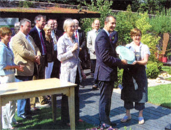 Edwin Poots presents Lucy Cook, designer of the Best In Show Garden 2008 with her award at last weekend's Gardenshow Ireland at Hillsborough Castle. Lucy's design was called 'Spoilt' and it was built by Hardy Hill Garden Centre. Lucy also received a gold award.