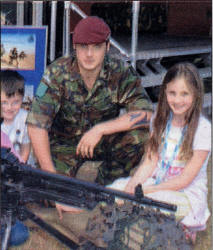 Private Neil Craig of The Parachute Regiment, originally from Lisburn with children from Kilross Primary School, Tobermore, who were on a day out at the Emmerdale Extravaganza.