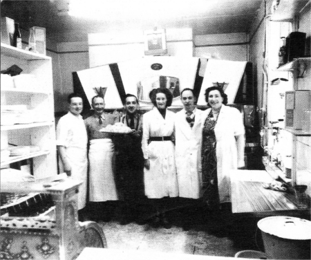 A new look at the Ginesi shop. This old photograph shows the shop in Market Square and how it would have looked to a customer. From left to right are: 15-year-old Dominic Ginesi, his father Frank Ginesi, Charlie Nicoletti, who owned a family business in Dromore, a girl who worked in JB Skellys, Dominic's brother Joe Ginesi and Mrs Rooney who worked in the business.