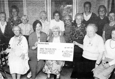 Mandy Wilson and Hazel Boomer from Save The Children Lisburn Branch receive a cheque of �400 from Tenants of Old Manor House and Manor Drive raised in the Save the Childrens Go Tea Potty Initiative. US2108-107A0 Picture By: Aidan O'Reilly