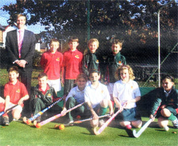 Budding Prep hockey players with Olympic gold medal winner Jimmy Kirkwood