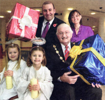 Launching this year's Christmas Switch-on are Mayor Ronnie Crawford, Paul McMahon from Cherton, Beverly White from the Open Arts Community Choir and two angels - Kathryn Boyde and Leah Bethel.