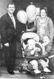 Helen Savage and her family - Aimee (2 1/2), Nathan (15 months) and five week old Freddie (5 weeks) - with Lagan Valley MP Jeffrey Donaldson.