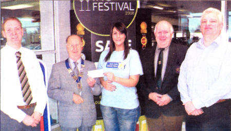 From left to right - Graham Agnew, Deputy Manager, Tesco Newtownbreda, Ivan Duffey, President Newtownbreda and Carryduff Lions Club, Grace Smyth, Community Fundraiser Marie Curie Cancer Care, Jimmy Davidson, Event Organiser Newtownbreda and Carryduff Lions Club, Paul Abraham. Tesco Wine Expert.