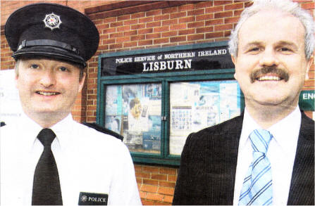 Chief Inspector David Moore of Lisburn PSNI with Councillor Thomas Beckett, Chairman of Lisburn District Policing Partnership. US1708-113A0