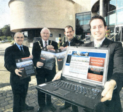 Pictured launching Lisburn City Council's On-line petition to bring John Lewis to Lisburn are Councillor Paul Givan, Chairman of the Council's Corporate Services Committee and (back row I-r) Mr David Briggs, Director of Corporate Services; the Mayor Councillor Ronnie Crawford and Deputy Mayor Alderman Edwin Poots.