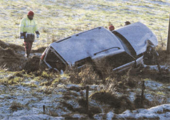 Police at the scene following the crash on the Divis Road outside Dundrod. Pic by Pacemaker Press.