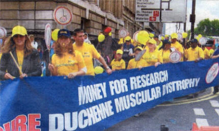 Muscular Dystrophy sufferers and their parents make their way through Parliament Square.