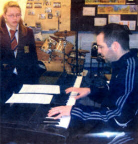 Dunmurry High Music Teacher Lloyd Scales with pupil Rebecca Dalzell rehearsing for the X-Factor