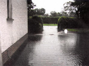 A home on the Ballinderry Road is surrounded by the flood water from the Ballinderry river.