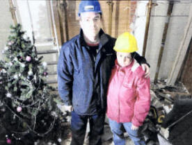 Paul and Leanne Gilliland in their home which was hit by a lorry.