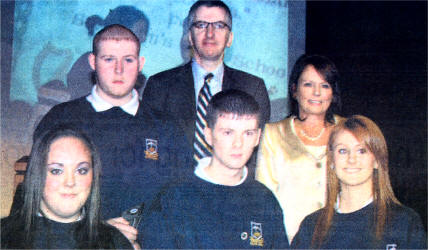 Mairtin 0 Muilleoir with Ashling Branney, Daniel Quinn, Sean Paul Ferguson and Carla Doherty., Father Murray, Chair St Colms High School with winner of Monsignor Bartley Award Patricia Neilson, who attained top marks in 6 GCSEs.