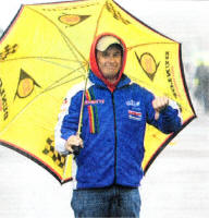 Top road racer John McGuinness gives the bad weather the thumbs down in the Ulster Grand Prix paddock.