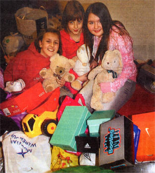 Charis Graham, Sara and Shona McComb pictured with shoe boxes and items donated to an Orphanage in the Ukraine. US0308-115A0