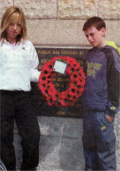 A pupil from each school, Conor McGovern and Jenna Cree, lay a wreath.