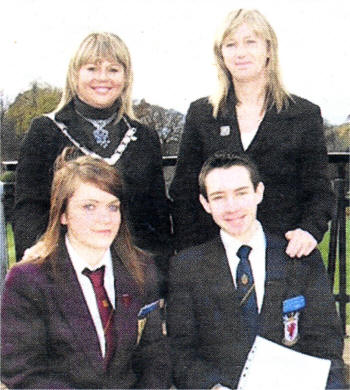 The Lisburn club finalists in the competition, Ellen McCalmont of Dunmurry HS and Jamie Pow of Wallace HS with the president of the Lisburn club Sandra McCabe and the chair of the Youth Committee Ellen Hillen