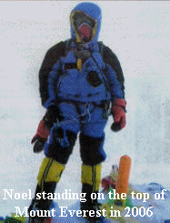 Noel standing on the top of Mount Everest in 2006
