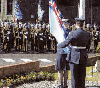 The RAF flag at the station HQ is lowered at the RAF Battle of Britain Service at Aldergrove.