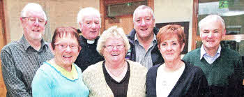 At St Patrick's pastoral centre are Pearse Lawlor, Peggy Agnew, Fr Dermot McCaughan, Eileen O'Neill, Pat Catney, Maura Lowery, and John McArdle, volunteers at the centre. US4609-512cd 