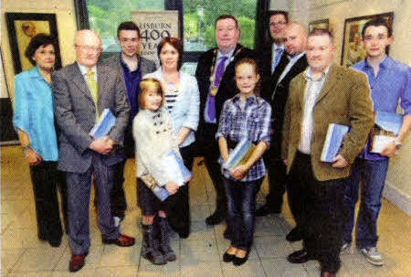 Pictured at the Council organised Photography Competition Awards event are (I-r) Mrs Felicity Graham, Lisburn Arts Advisory Committee (Judge); Mr Robert Wilkinson; Mr Mark Douglas; Councillor Jenny Palmer, Chairman of the Council's Economic Development Committee; Miss Lucy Hewitt; Alderman Paul Porter, Deputy Mayor; Miss Emily Lester; Councillor Andrew Ewing; Mr Andy McDonough, Eclipso Pictures (Judge); Mr David McDonald and Mr Andrew McCoy. US4009- Photographic winner: