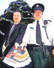 Laurence Kerr, Safer Lisburn Manager, and Chief Inspector David Moore of Lisburn PSNI launching operation Season's Greetings in Bow Street on Friday. US4809-113A0