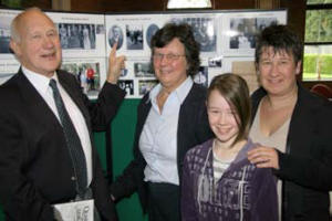 Alan and Irene Bell with their daughter Catherine and granddaughter Rachael looking at family photographs 