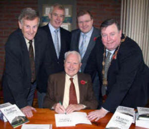 Arthur Chapman pictured signing a copy of his book. Looking on are L to Ft Glynn Douglas (guest speaker), Ken Brown (Lisburn Friend), Councillor Jonathan Craig MLA and Alderman Paul Porter (Deputy Mayor). 