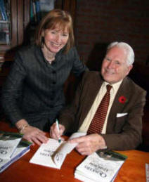 Arthur Chapman, former head of Friends' School, signing a copy of his book for the current bead Elizabeth Dickson. 